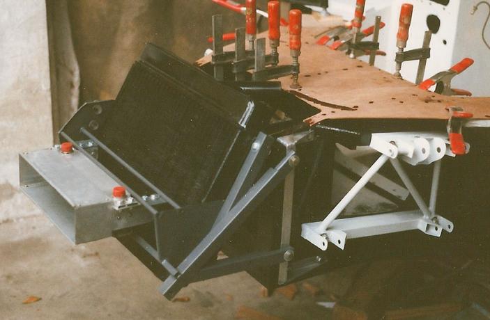 Radiator, oil cooler and bonnet mountings during restoration – bit of woodwork going on as well
